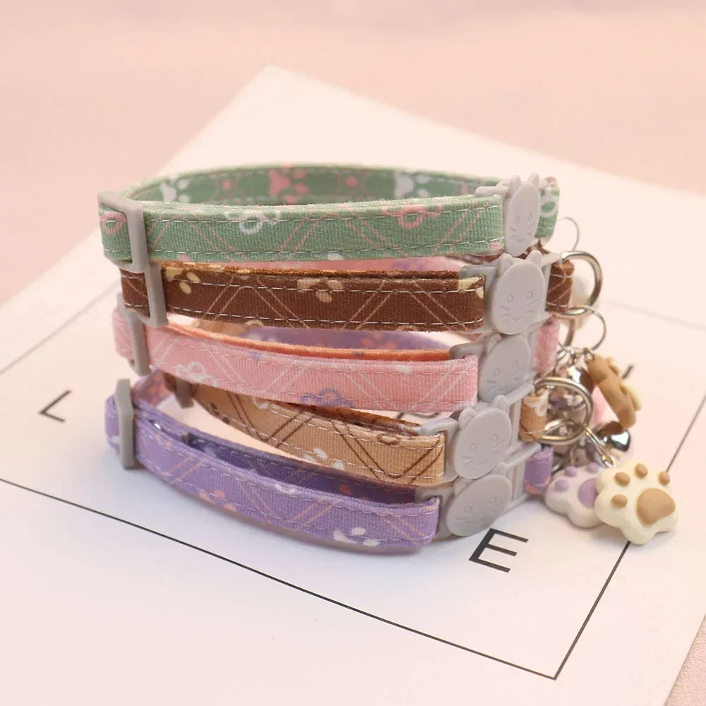 Adjustable footprint print pet collar with bell for cats

Small dog breakaway safety collar with cute design

Cat and kitten collar with bell and adjustable buckle

Puppy footprint collar with quick-release safety feature

Lightweight cute pet collar for dogs and cats