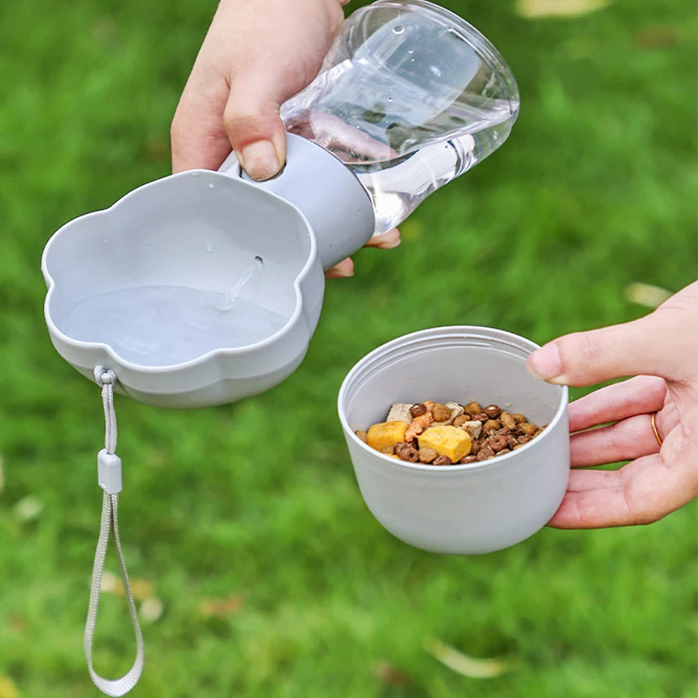 Claw-shaped 2-in-1 pet water bottle and food container with built-in bowl

Portable pet drinking bottle with snack storage and leak-proof lid

One-hand operation travel bottle for dogs with food and water compartments

Compact claw-style pet water dispenser and snack container for walking